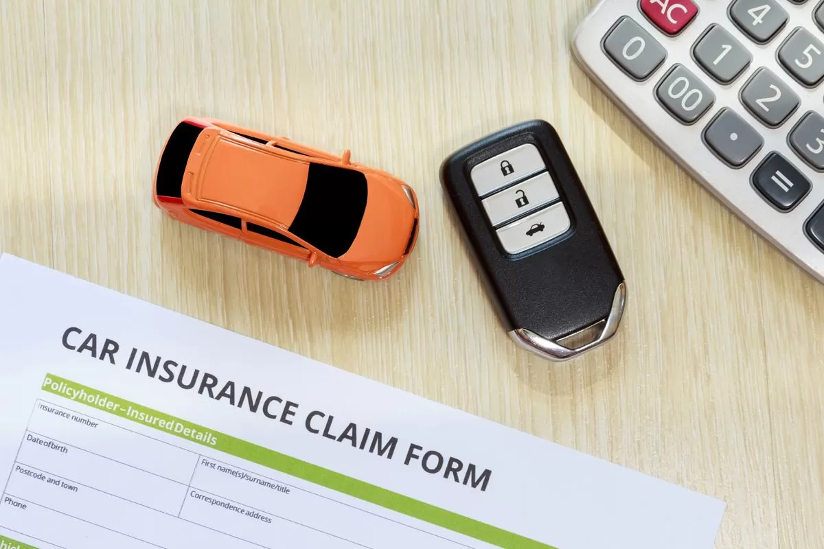 A car insurance claim form on a table